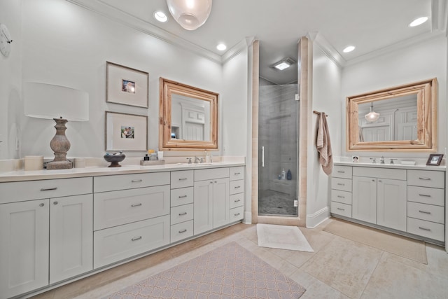 bathroom featuring tile patterned flooring, ornamental molding, vanity, and a shower with shower door