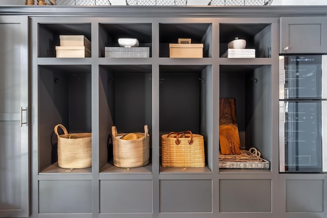 mudroom with washer / dryer and beverage cooler