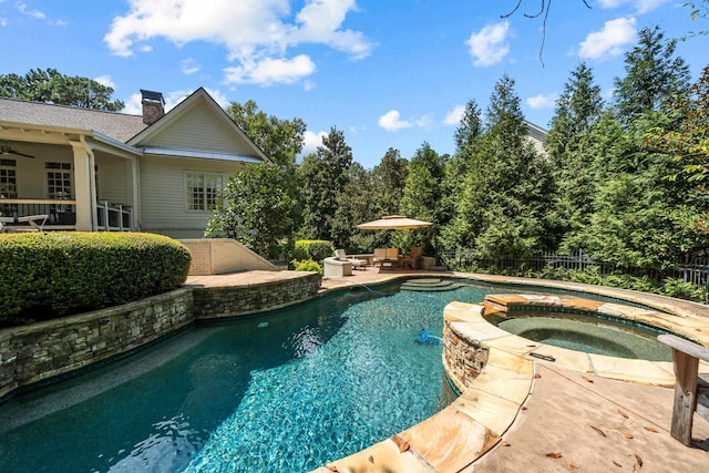 view of pool featuring an in ground hot tub and a patio