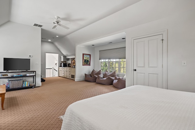 carpeted bedroom featuring vaulted ceiling