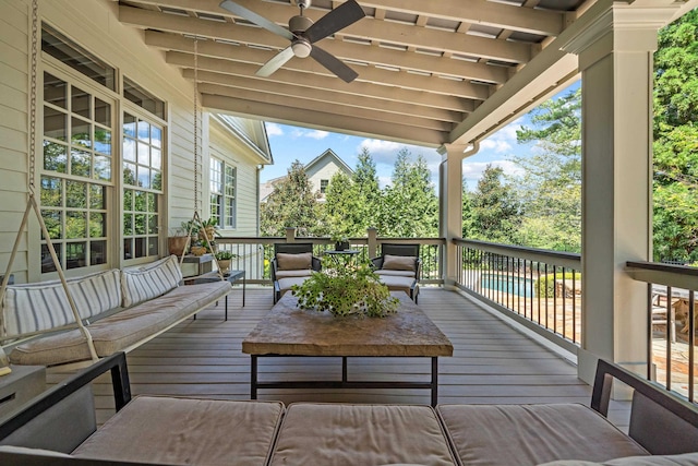 deck featuring a pool, an outdoor hangout area, and ceiling fan