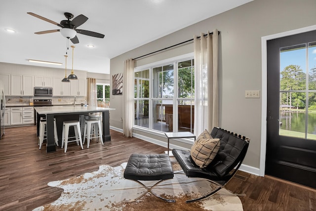 1005 Dennis St, Eatonton, GA 31024 - living area featuring dark wood-style flooring, a ceiling fan, and recessed lighting