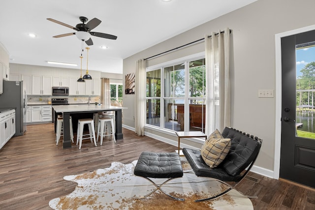 1005 Dennis St, Eatonton, GA 31024 - living area with wood finished floors, recessed lighting, and a ceiling fan