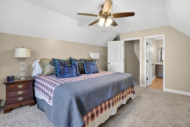 1005 Dennis St, Eatonton, GA 31024 - bedroom with vaulted ceiling, light carpet, a ceiling fan, and connected bathroom