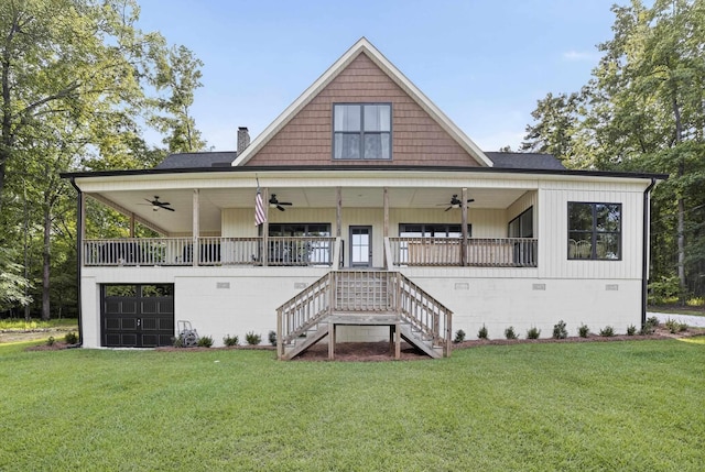 1005 Dennis St, Eatonton, GA 31024 - view of front of home featuring a ceiling fan, a front yard, a chimney, stairway, and a porch