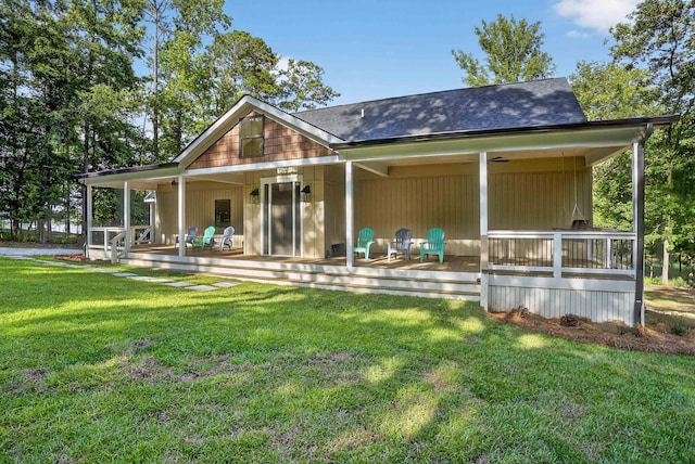 1005 Dennis St, Eatonton, GA 31024 - rear view of property featuring a yard and covered porch