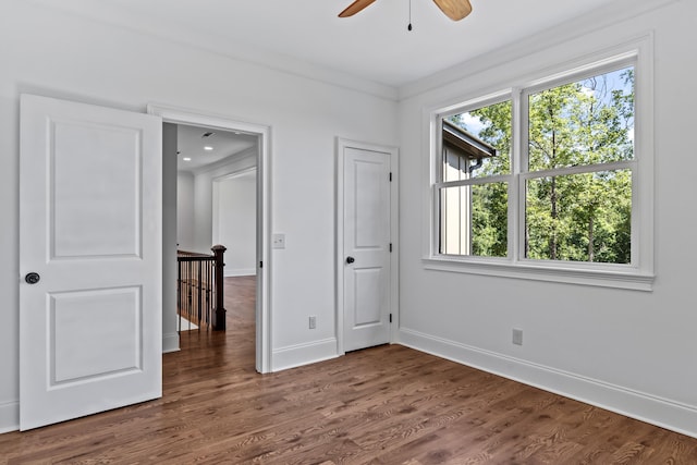 unfurnished bedroom with dark hardwood / wood-style floors