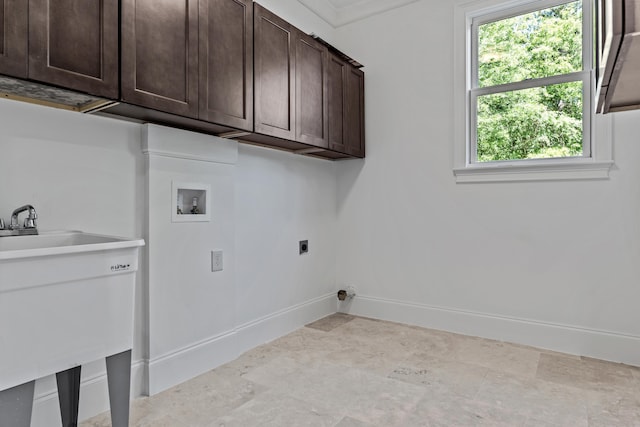 washroom with cabinets, washer hookup, sink, and hookup for an electric dryer