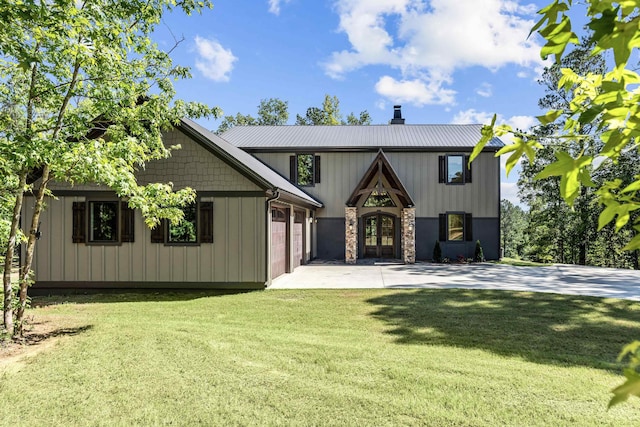 view of front of home with a garage and a front yard