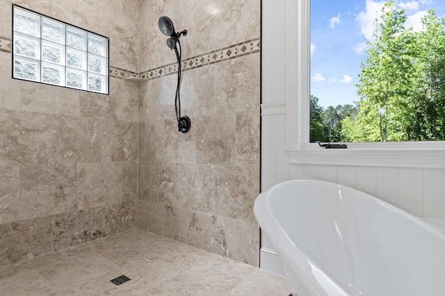 bathroom with separate shower and tub