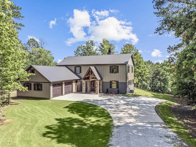 view of front of house featuring a garage and a front lawn