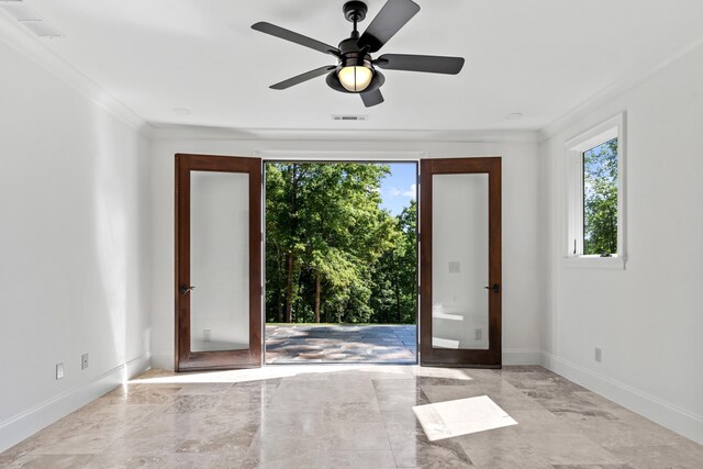 interior space featuring crown molding, french doors, and a healthy amount of sunlight