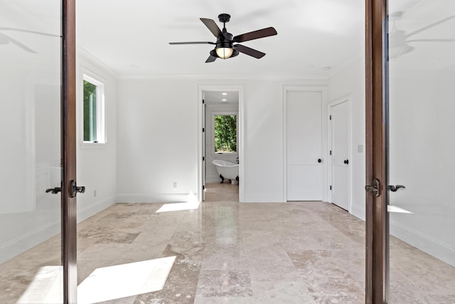 unfurnished room featuring plenty of natural light, french doors, and ceiling fan