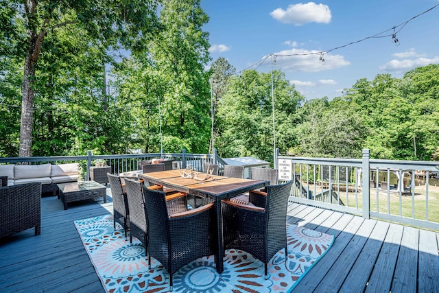 wooden deck with an outdoor living space