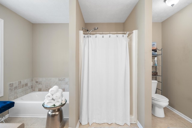 bathroom with a textured ceiling, tile patterned floors, shower with separate bathtub, and toilet