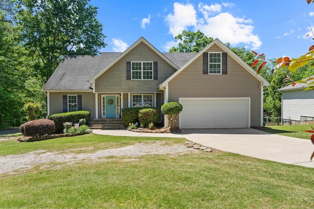 view of front of home featuring a garage and a front lawn