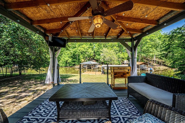 view of patio / terrace featuring a gazebo, a water view, and ceiling fan