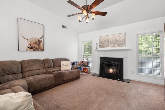 living room with carpet floors, ceiling fan, and vaulted ceiling