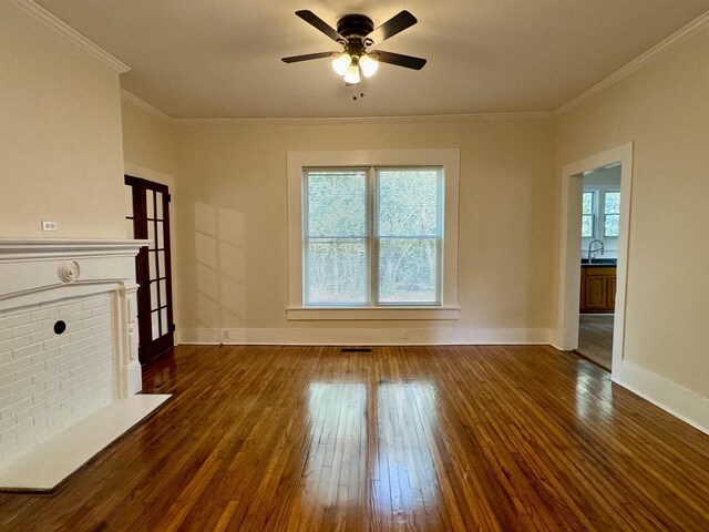 unfurnished living room with crown molding, ceiling fan, dark hardwood / wood-style flooring, and french doors