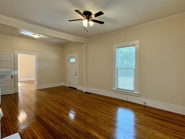 interior space with ornamental molding, dark wood-type flooring, and ceiling fan