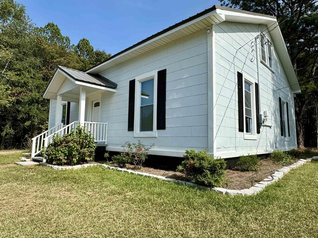 view of property exterior featuring a yard