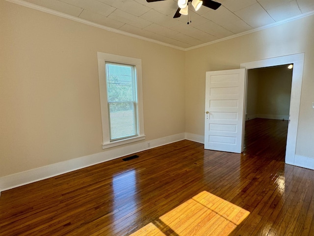 unfurnished room featuring ornamental molding, ceiling fan, and dark hardwood / wood-style flooring