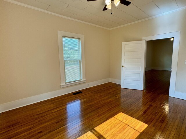 unfurnished room featuring ornamental molding, ceiling fan, and dark hardwood / wood-style flooring