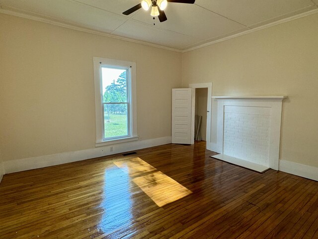 unfurnished room with ornamental molding, dark wood-type flooring, and ceiling fan