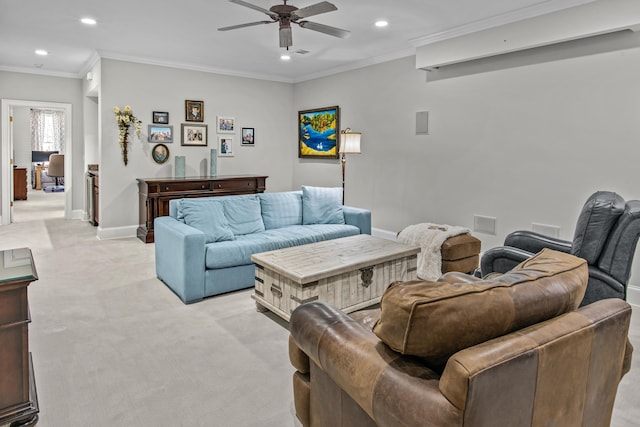 living room with crown molding, recessed lighting, baseboards, and light colored carpet