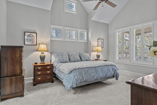 carpeted bedroom featuring high vaulted ceiling, ceiling fan, and baseboards