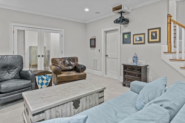 carpeted living room featuring visible vents, baseboards, french doors, stairway, and crown molding