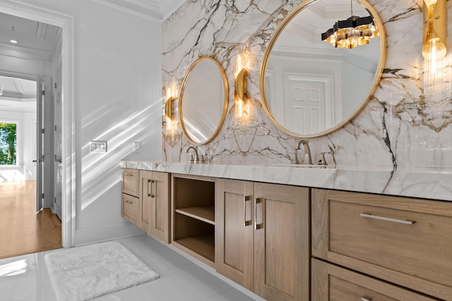 bathroom featuring vanity, ornamental molding, and backsplash