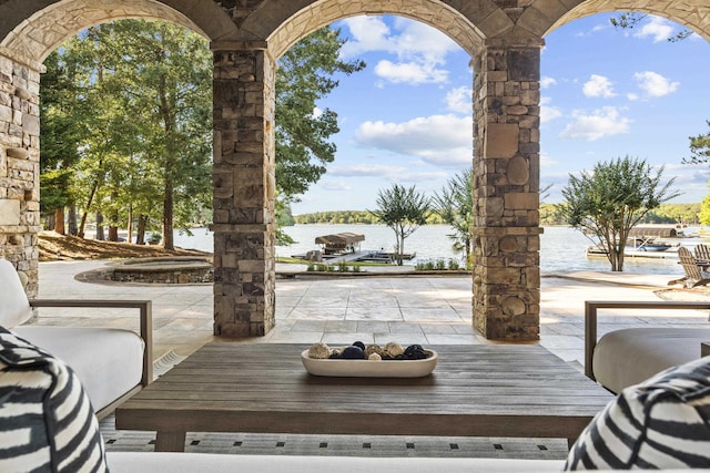 view of patio with a water view