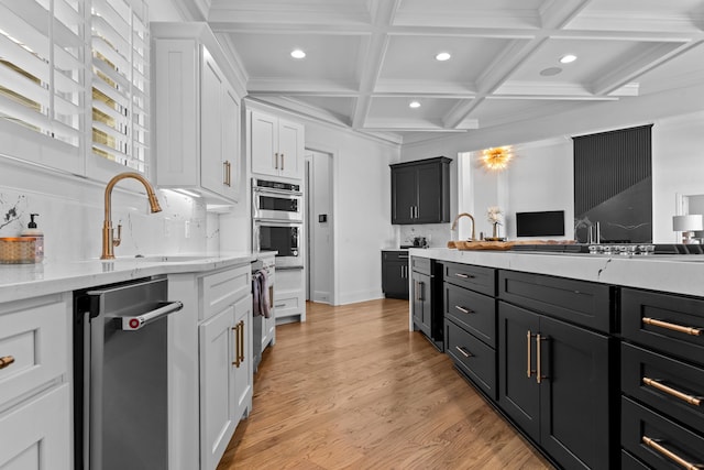 kitchen featuring coffered ceiling, backsplash, light hardwood / wood-style floors, white cabinets, and beam ceiling