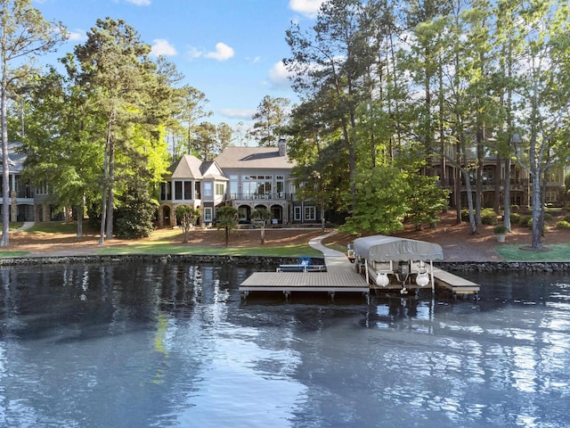 back of property with a water view