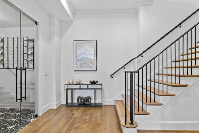 interior space with crown molding and hardwood / wood-style floors