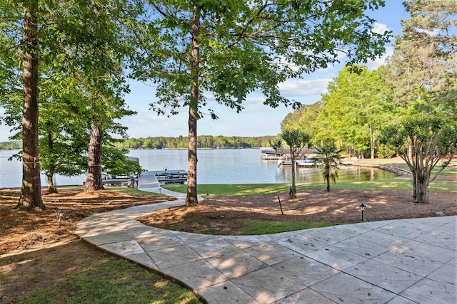 exterior space with a water view and a boat dock