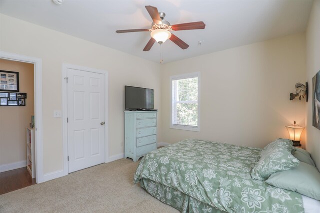 carpeted bedroom featuring ceiling fan