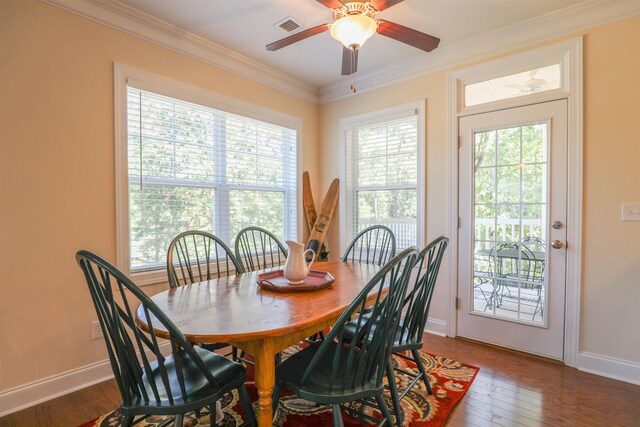 dining area with crown molding, plenty of natural light, dark hardwood / wood-style floors, and ceiling fan