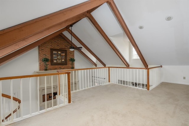 bonus room featuring lofted ceiling with skylight, carpet, and ceiling fan