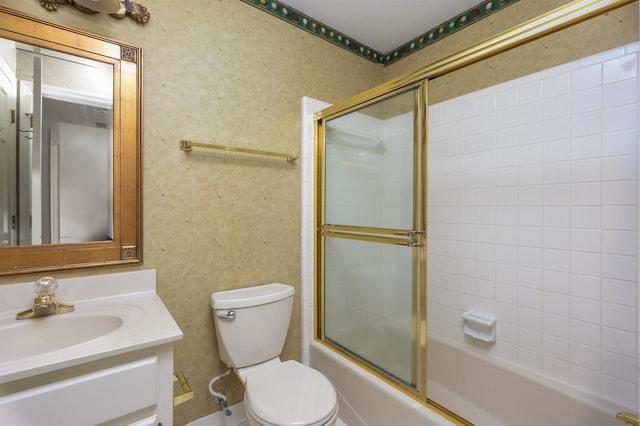 bathroom with shower / bath combination with glass door, vanity, toilet, and wallpapered walls