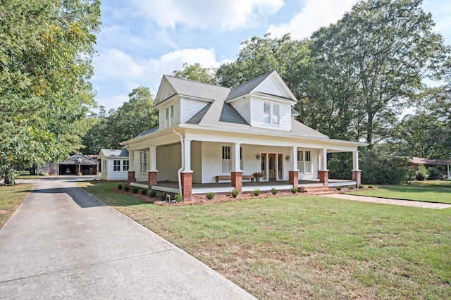 farmhouse-style home featuring a front lawn and covered porch