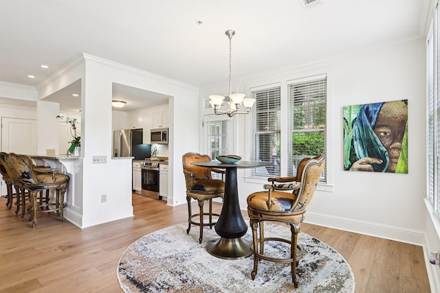 1010A Creekside, Greensboro, GA 30642 - dining room with a chandelier, ornamental molding, light wood-style flooring, baseboards, and recessed lighting