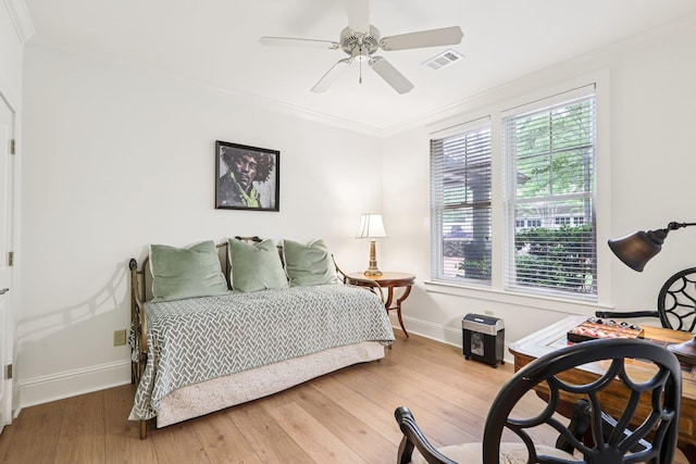 1010A Creekside, Greensboro, GA 30642 - bedroom with baseboards, ornamental molding, wood finished floors, and a ceiling fan