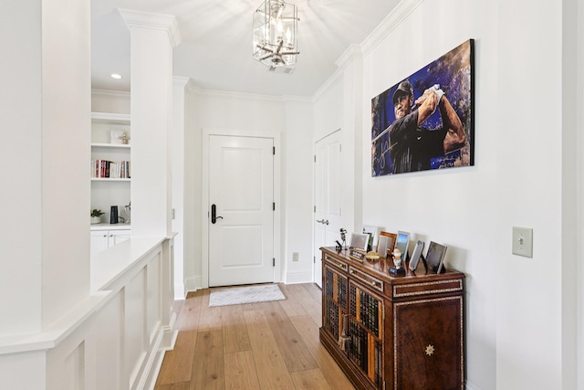 1010A Creekside, Greensboro, GA 30642 - foyer featuring light wood finished floors, ornamental molding, a chandelier, and recessed lighting
