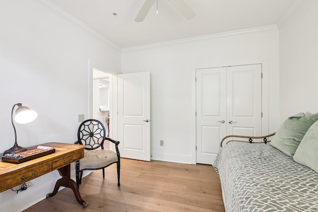 1010A Creekside, Greensboro, GA 30642 - bedroom with crown molding, light wood finished floors, baseboards, a closet, and ceiling fan