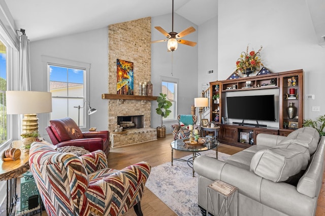 1181 Hidden Hills Cir, Greensboro, GA 30642 - living room with high vaulted ceiling, a ceiling fan, a fireplace, and wood finished floors