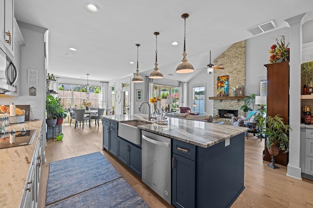 1181 Hidden Hills Cir, Greensboro, GA 30642 - kitchen featuring appliances with stainless steel finishes, healthy amount of natural light, blue cabinets, a ceiling fan, and recessed lighting