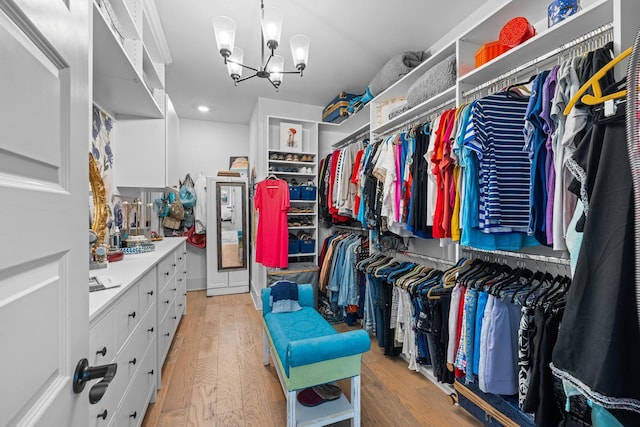 1181 Hidden Hills Cir, Greensboro, GA 30642 - spacious closet with light wood-style flooring and a chandelier