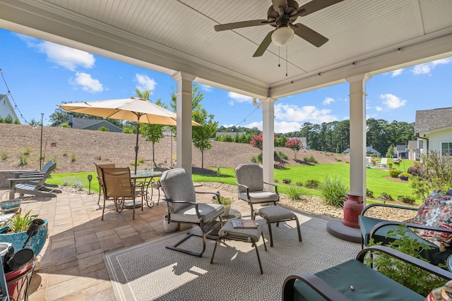 1181 Hidden Hills Cir, Greensboro, GA 30642 - fenced backyard featuring a patio area, ceiling fan, and outdoor dining area
